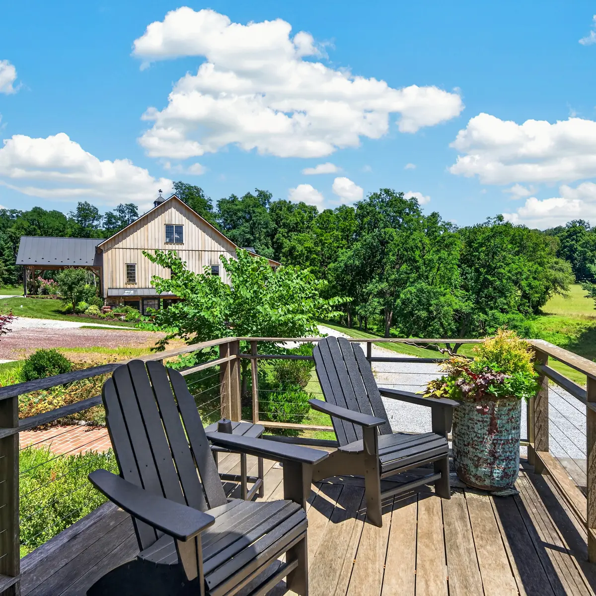 Deck seating with a view across the drive to the Barn