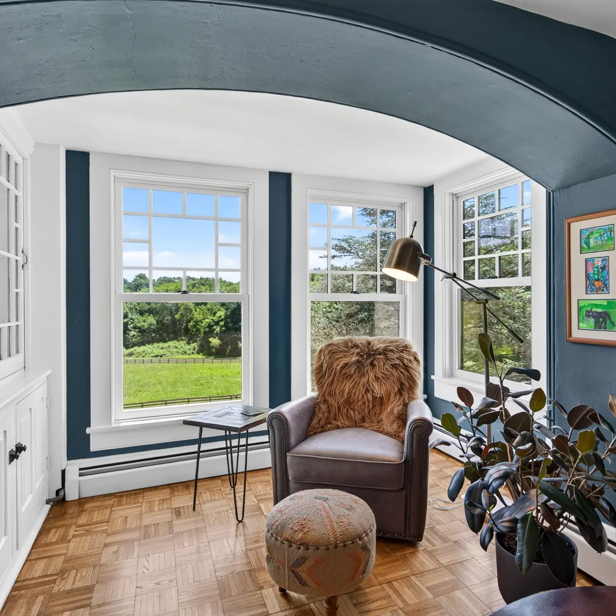 Arched window alcove sitting nook with pasture view